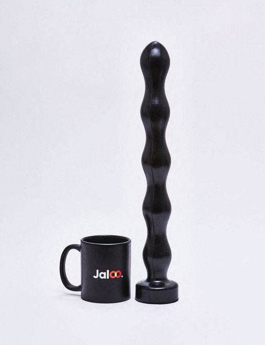 41.5cm XL dildo All Black compared to the size of a mug