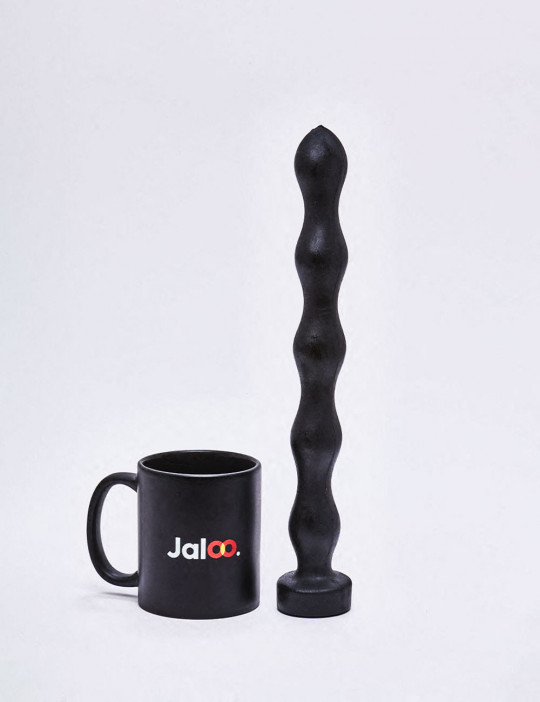 XL Dildo from All Black in 32cm compared to a mug